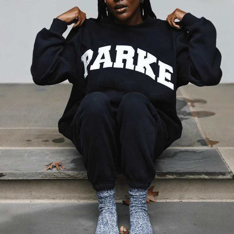 Women's oversized varsity sweatshirt with mock neck and front lettering