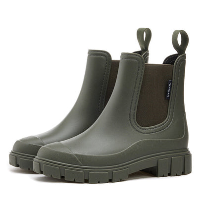 Women's waterproof chelsea ankle boots with chunky lug sole and pull loops, shown in pink and black