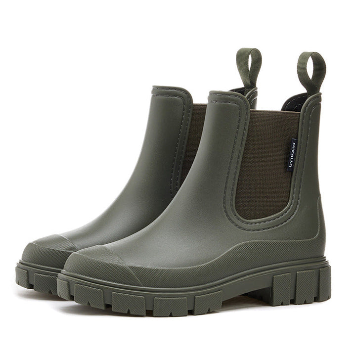 Women's waterproof chelsea ankle boots with chunky lug sole and pull loops, shown in pink and black