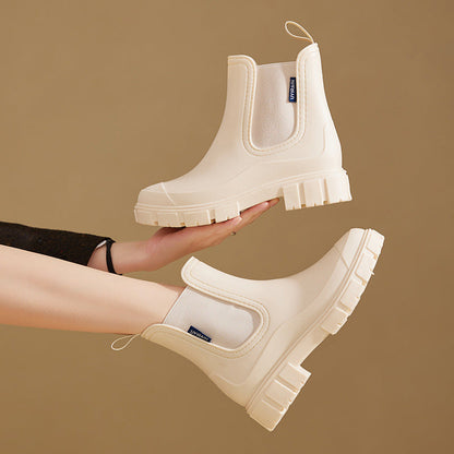 Women's waterproof chelsea ankle boots with chunky lug sole and pull loops, shown in pink and black