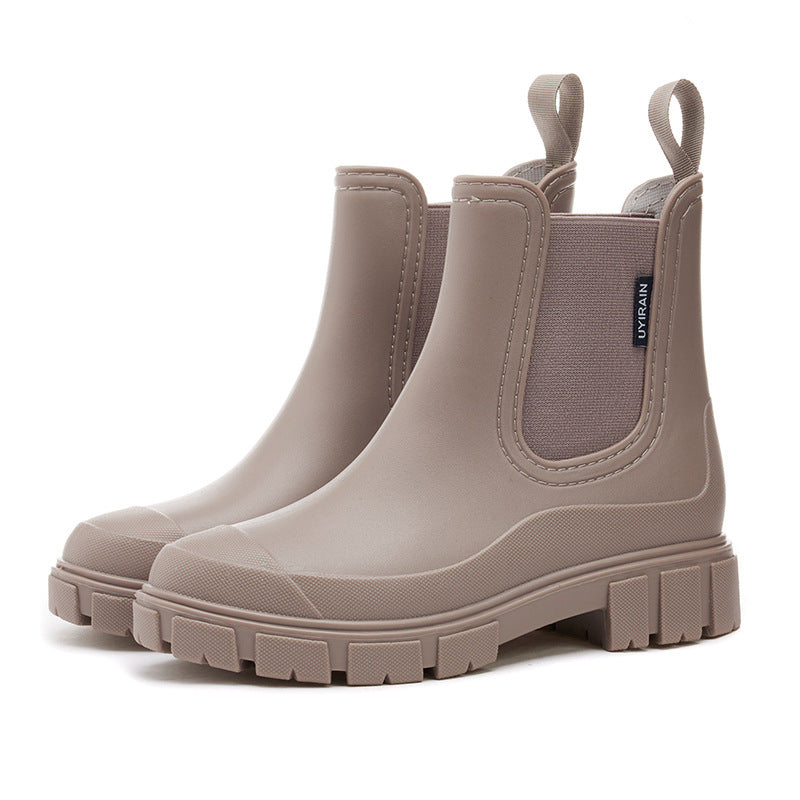 Women's waterproof chelsea ankle boots with chunky lug sole and pull loops, shown in pink and black
