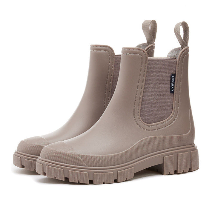 Women's waterproof chelsea ankle boots with chunky lug sole and pull loops, shown in pink and black