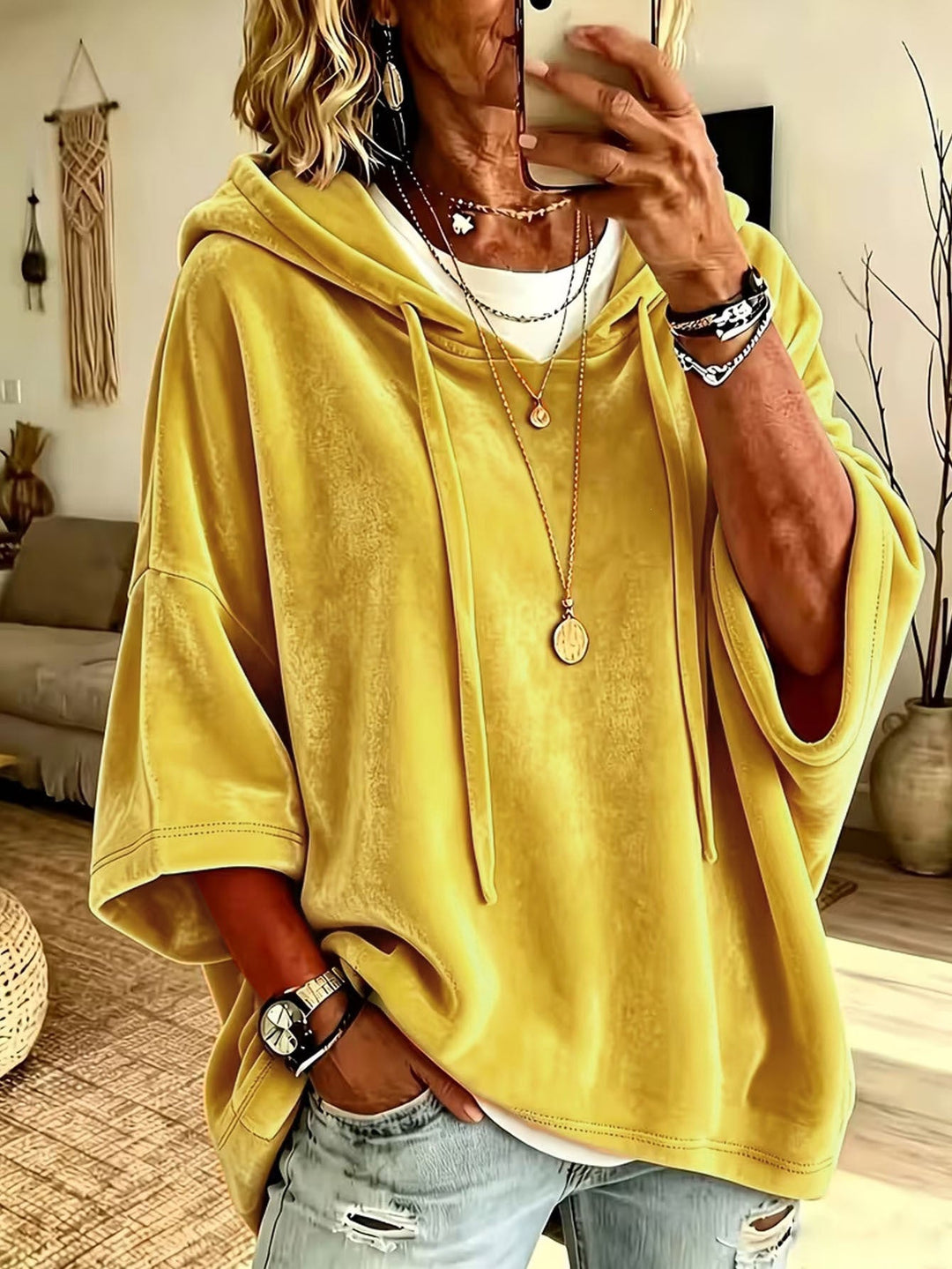 Women's oversized hoodie with drawstring hood and wide sleeves
