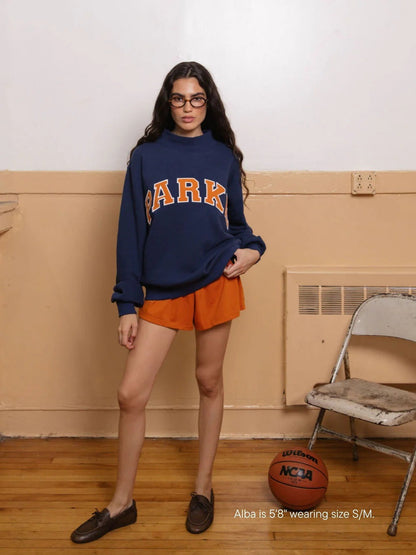 Women's oversized varsity sweatshirt with mock neck and front lettering