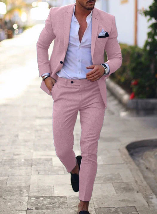 Men's textured two piece suit with notched lapel blazer and tapered trousers
