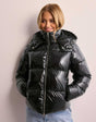 Women's glossy quilted hooded puffer jacket with front zipper and side pockets