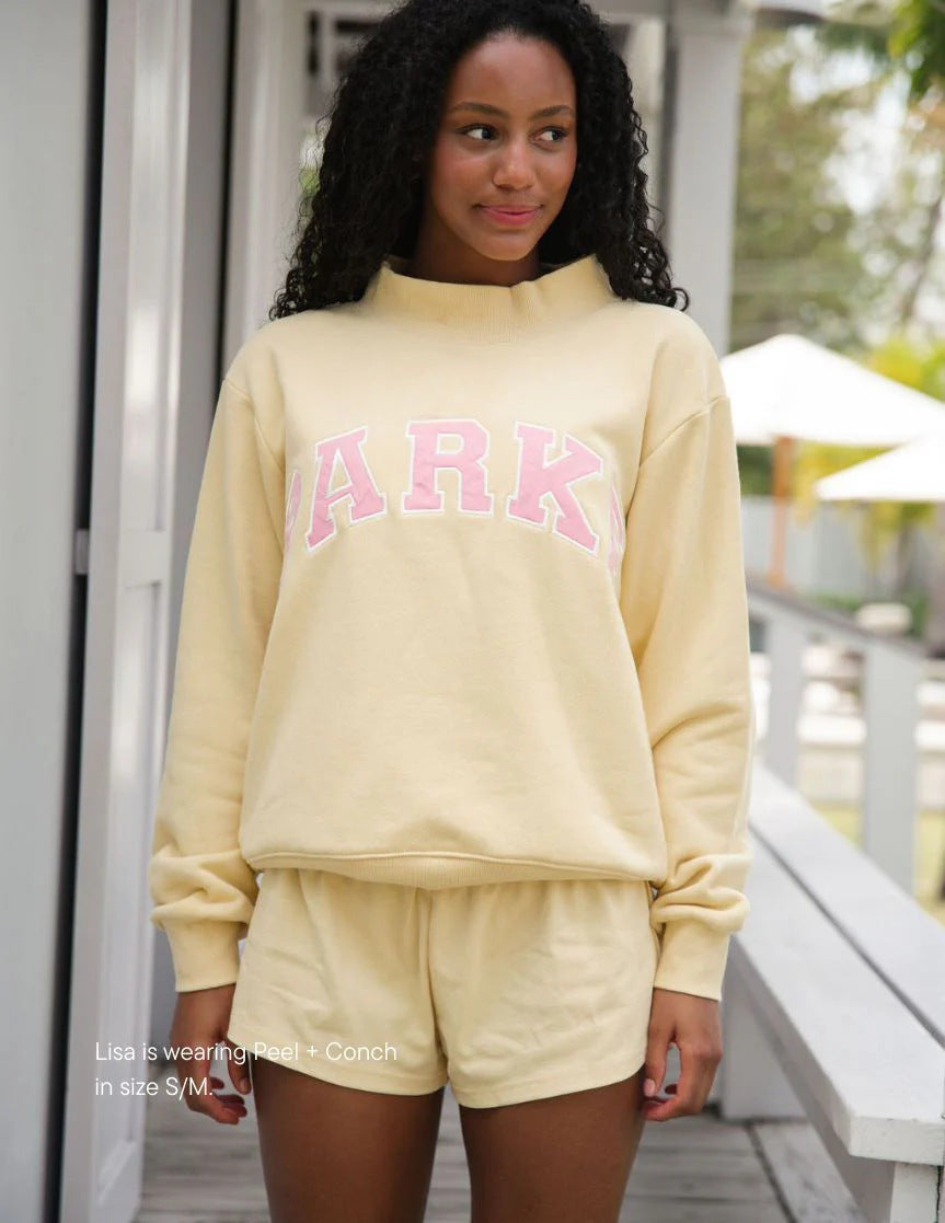Women's oversized varsity sweatshirt with mock neck and front lettering