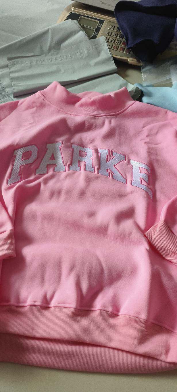 Women's oversized varsity sweatshirt with mock neck and front lettering