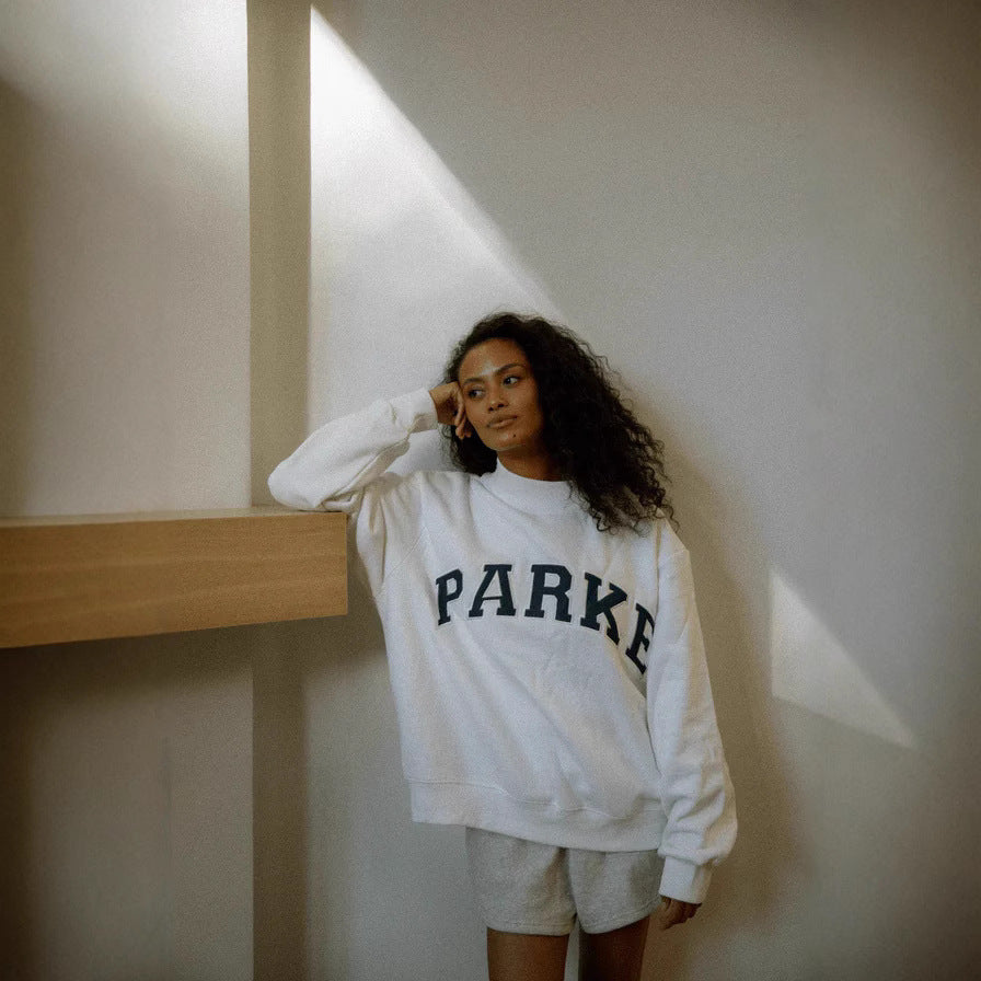 Women's oversized varsity sweatshirt with mock neck and front lettering