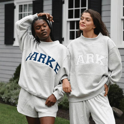 Women's oversized varsity sweatshirt with mock neck and front lettering
