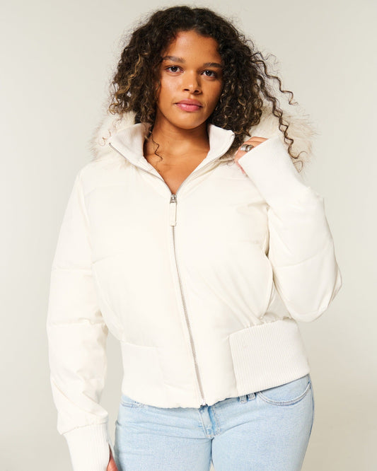 Women's quilted hooded puffer jacket with zip front and ribbed trims