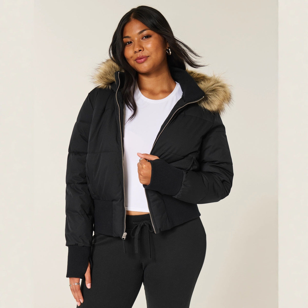 Women's quilted hooded puffer jacket with zip front and ribbed trims