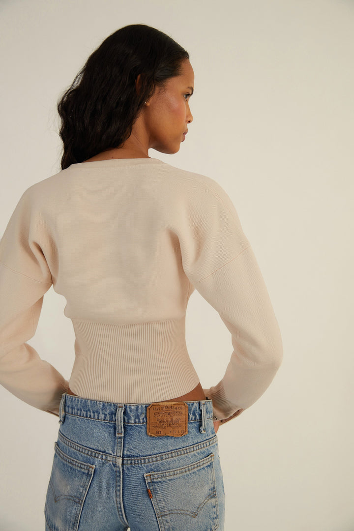 Women's cropped button-up cardigan with long sleeves