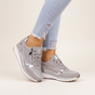 Women's low-top lace-up sneakers with metallic panels and textured soles