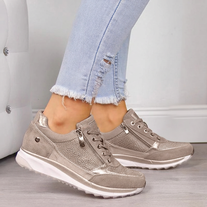 Women's low-top lace-up sneakers with metallic panels and textured soles
