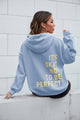 Women's graphic hoodie with hood, long sleeves and back text print