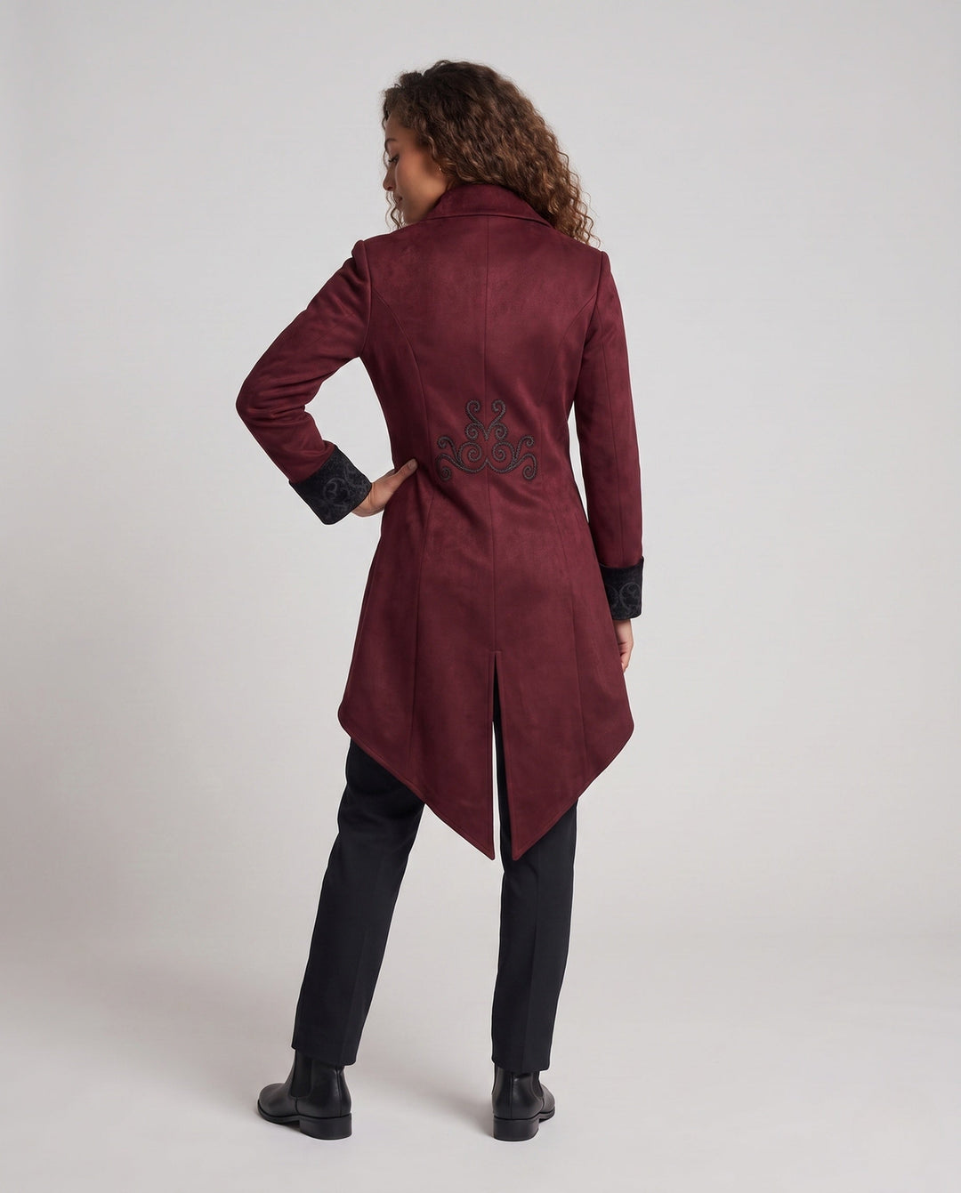 Women's embroidered long tailcoat jacket with raised collar, decorative buttons and pointed tails