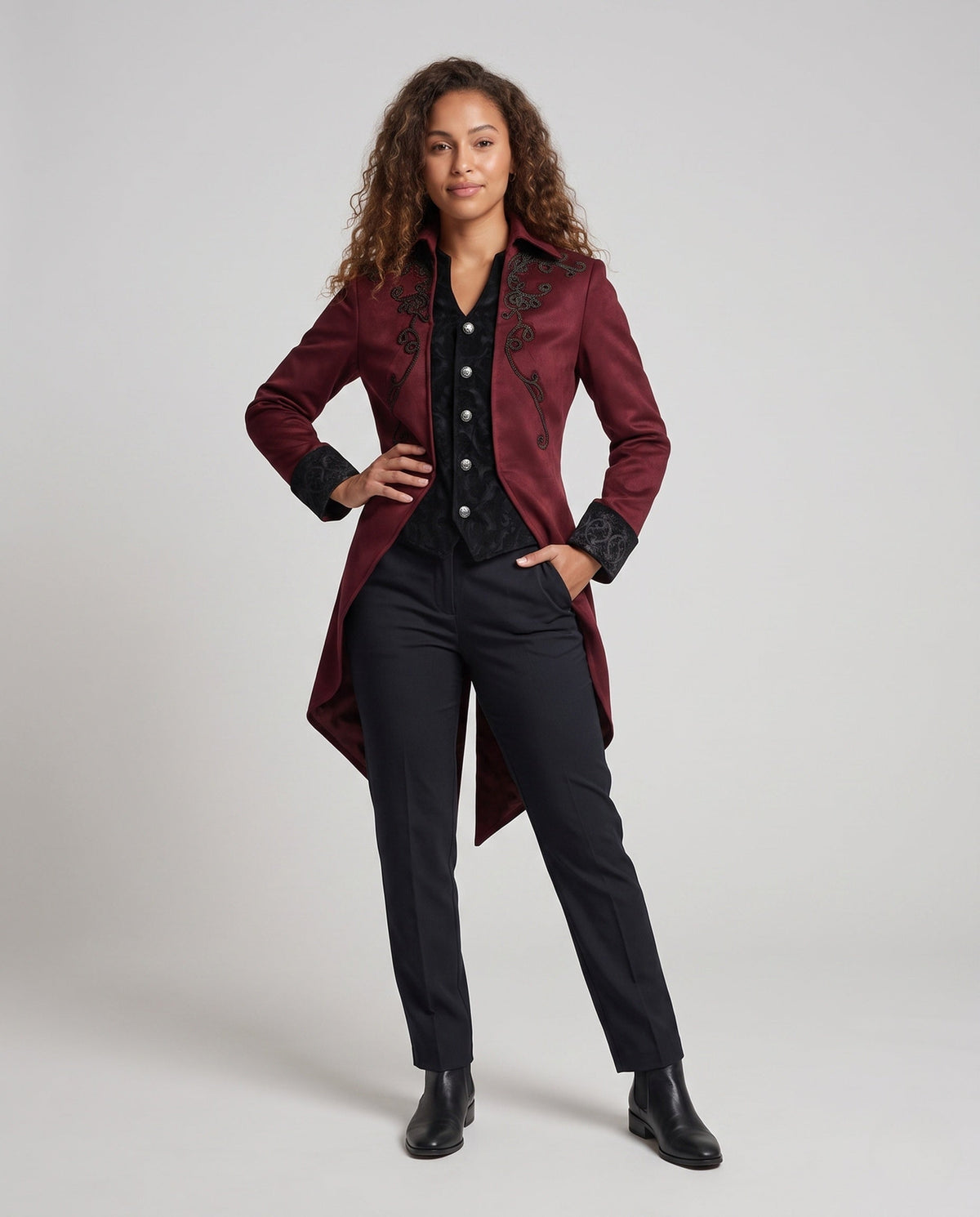 Women's embroidered long tailcoat jacket with raised collar, decorative buttons and pointed tails