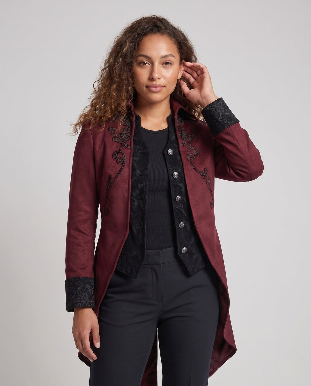 Women's embroidered long tailcoat jacket with raised collar, decorative buttons and pointed tails
