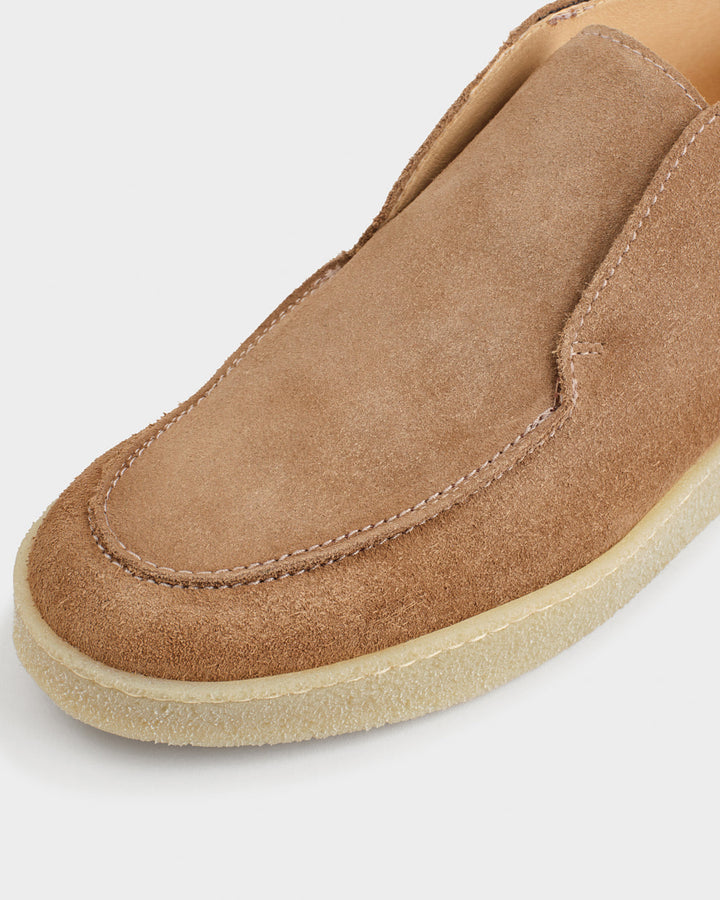 Men's brown moc toe ankle boots with slip-on styling and low soles