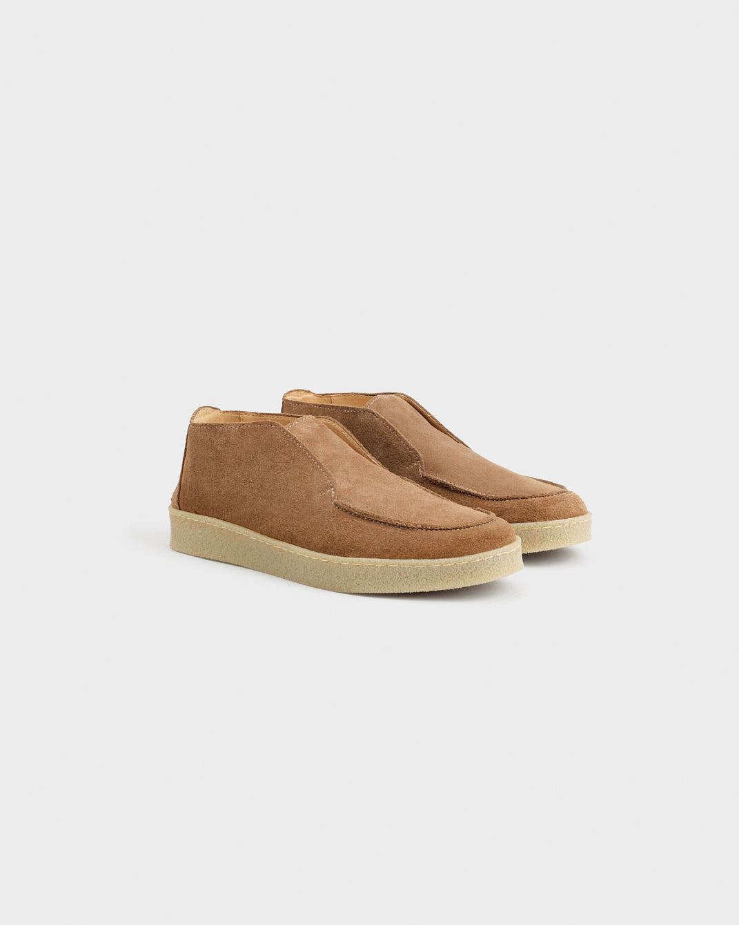 Men's brown moc toe ankle boots with slip-on styling and low soles