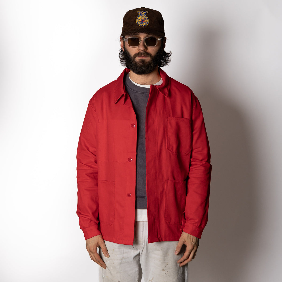 Men's red utility jacket with point collar, button front and patch pockets