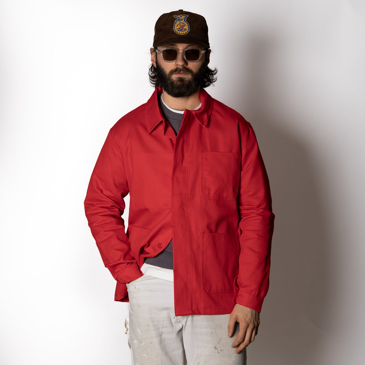 Men's red utility jacket with point collar, button front and patch pockets