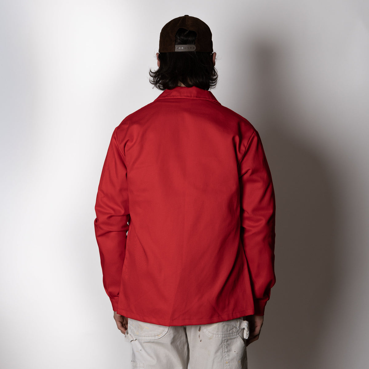 Men's red utility jacket with point collar, button front and patch pockets