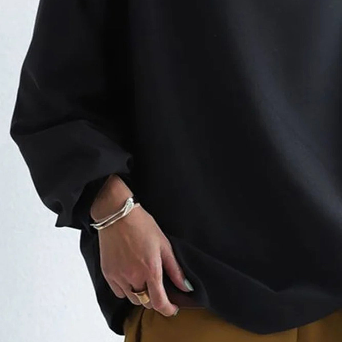 Women's black oversized mock neck sweater with long sleeves