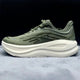 Low-top lace-up running sneaker with thick cushioned sole