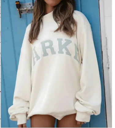 Women's pink oversized crewneck sweatshirt with letter graphic