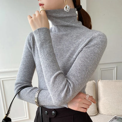 Women's ribbed turtleneck sweater with long sleeves and a slim fit