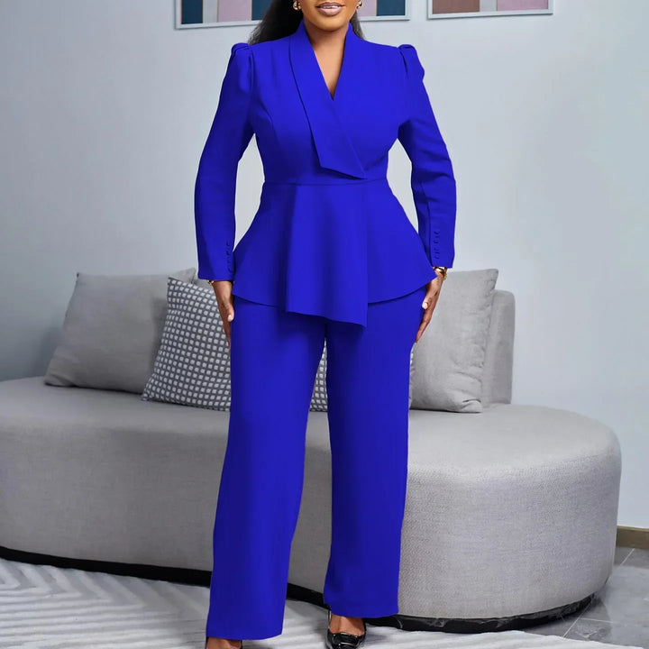 Woman wearing a beige peplum blazer suit set with wide-leg trousers