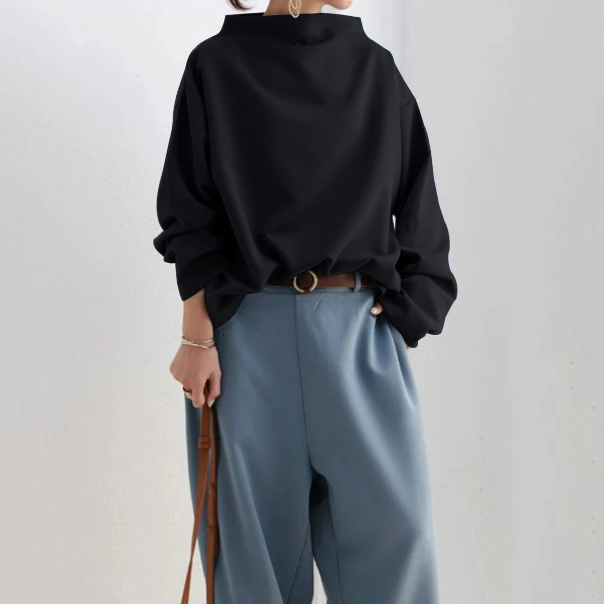 Women's relaxed high-neck top with long sleeves and wide cuffs