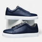 Men's low-top slip-on sneakers with stitched panels and flat white soles
