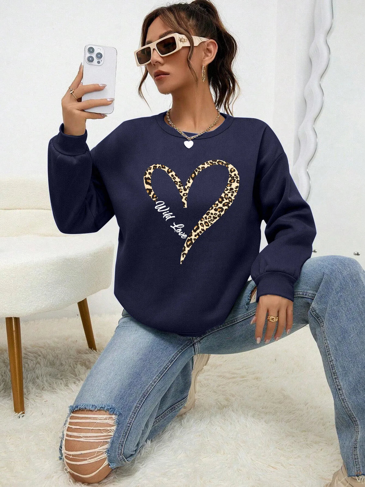 Women's sweatshirt with leopard-print heart graphic, crew neckline and long sleeves