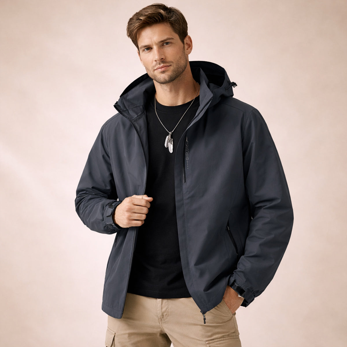 Men's hooded zip-front rain jacket with long sleeves and side zip pockets