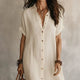 Women's button-front shirt midi dress with short sleeves and asymmetric hemline