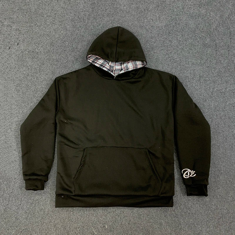 Loose hooded sweatshirt with plaid lining and kangaroo pocket