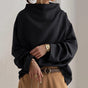 Women's relaxed high-neck top with long sleeves and wide cuffs