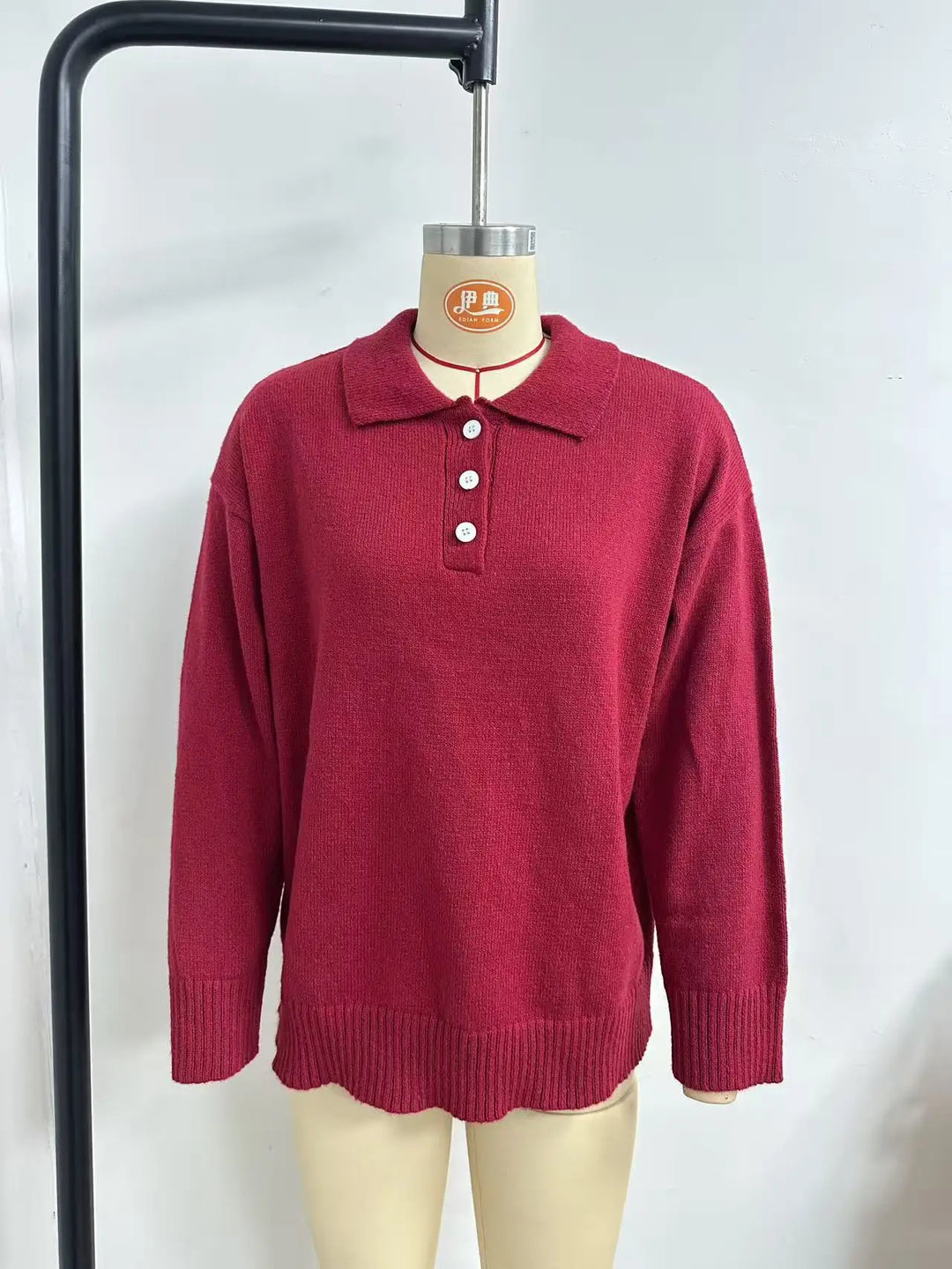 Women's collared knit sweater with button placket and long sleeves