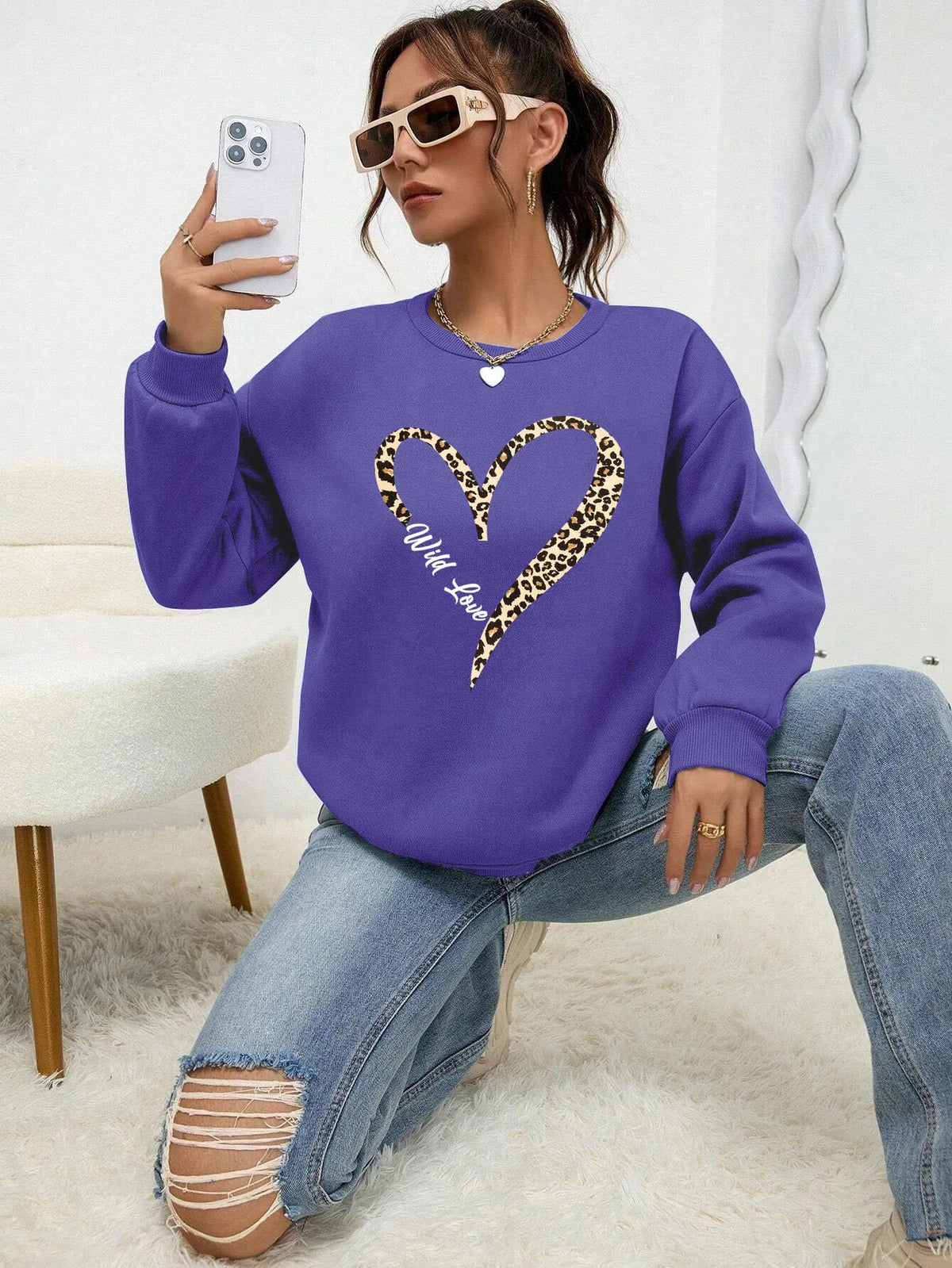 Women's sweatshirt with leopard-print heart graphic, crew neckline and long sleeves