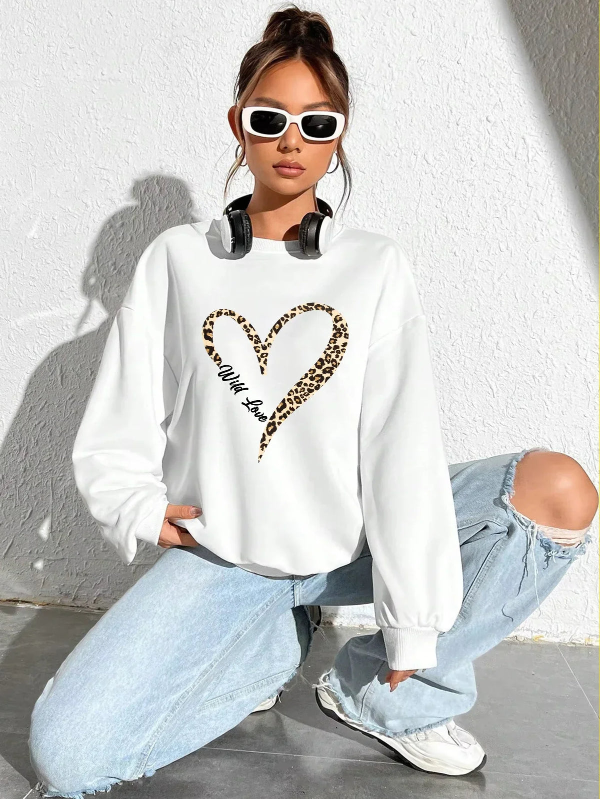 Women's sweatshirt with leopard-print heart graphic, crew neckline and long sleeves
