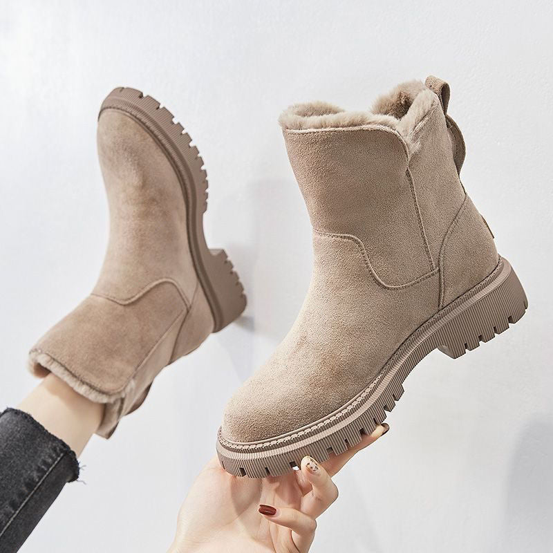 Women's ankle boots with fur-trimmed openings and chunky lug soles