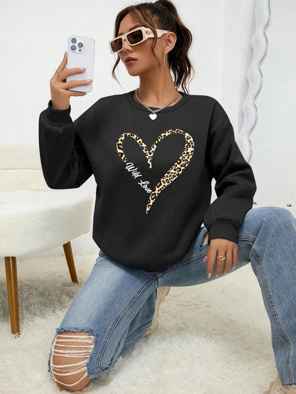 Women's sweatshirt with leopard-print heart graphic, crew neckline and long sleeves