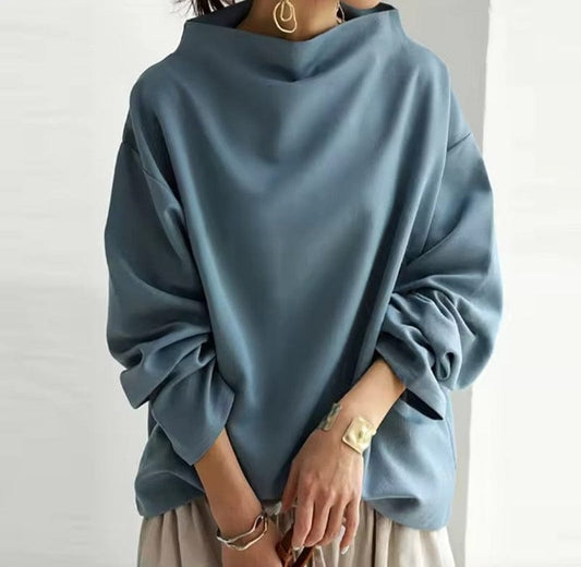 Women's relaxed high-neck top with long sleeves and wide cuffs