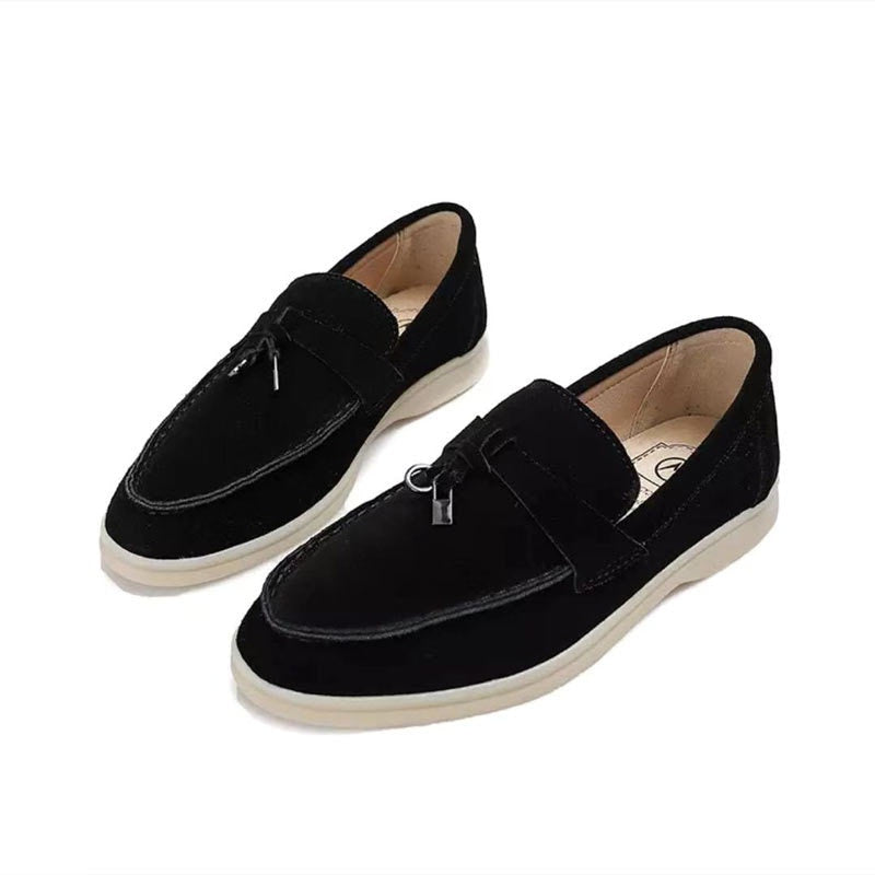 Women's flat slip-on loafers with rounded moc toe and metal trim