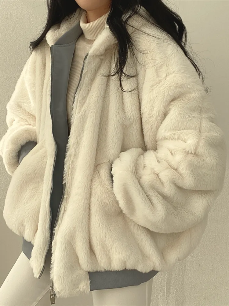 Women's lined bomber-style winter jacket with plush collar and zip front