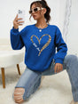 Women's sweatshirt with leopard-print heart graphic, crew neckline and long sleeves