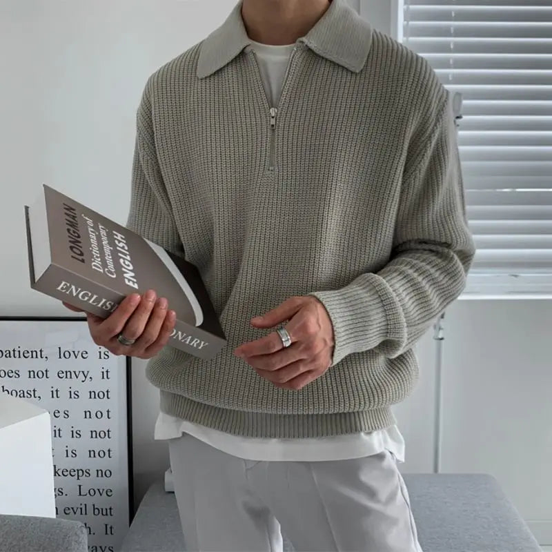 Men's quarter zip rib knit sweater with collared neckline and long sleeves